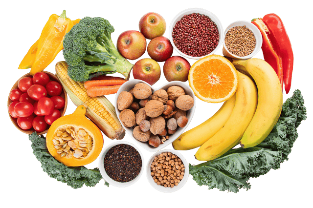 Potraviny bohaté na vlákninu jako ovoce, zelenina, luštěniny a ořechy pro podporu trávení a zdraví střev